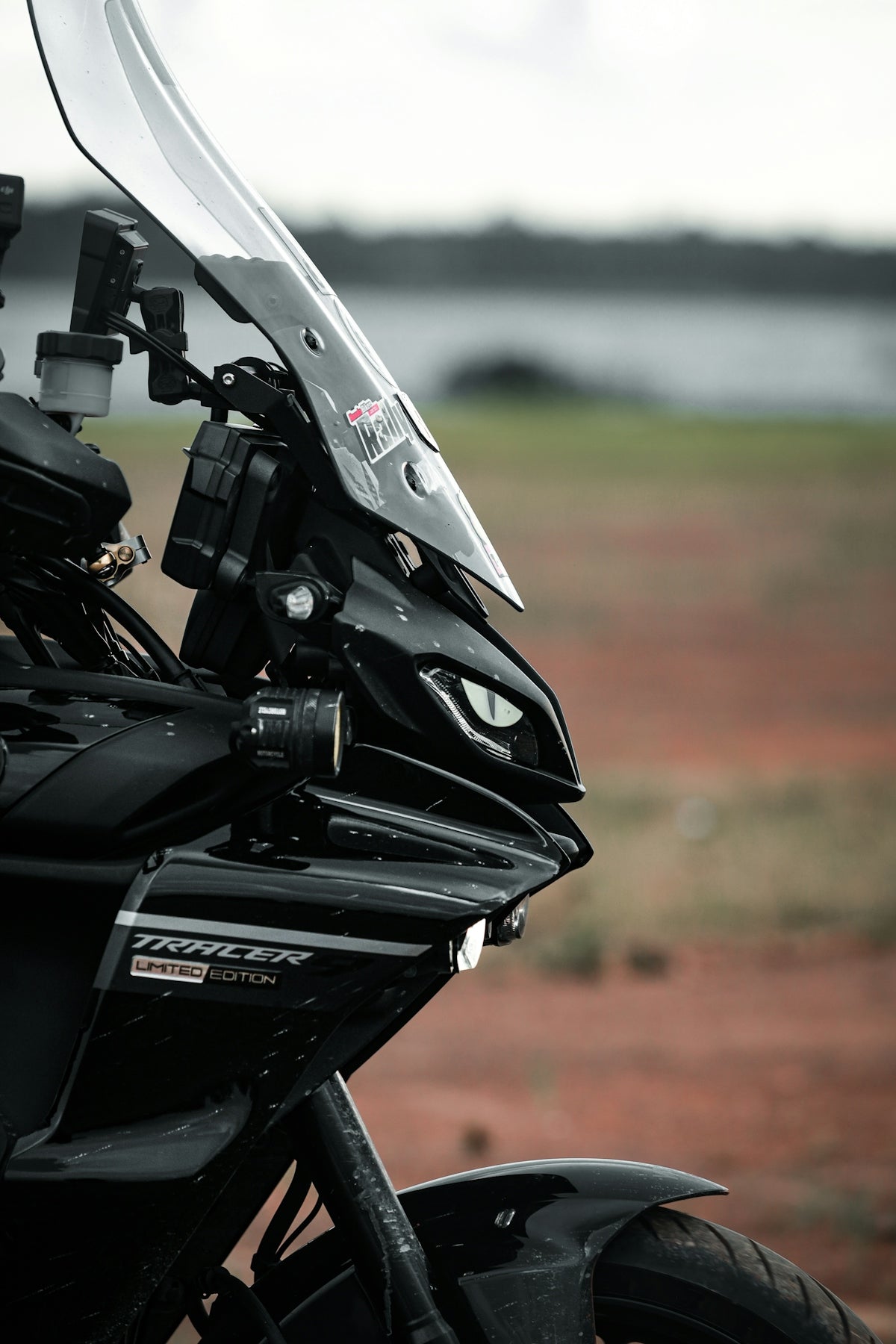 Close-up of a black motorcycle with a windshield