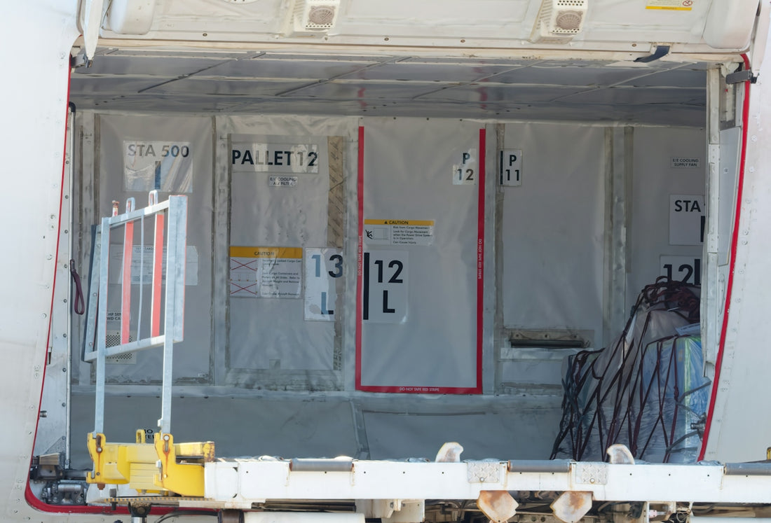 Cargo containers inside an open airplane